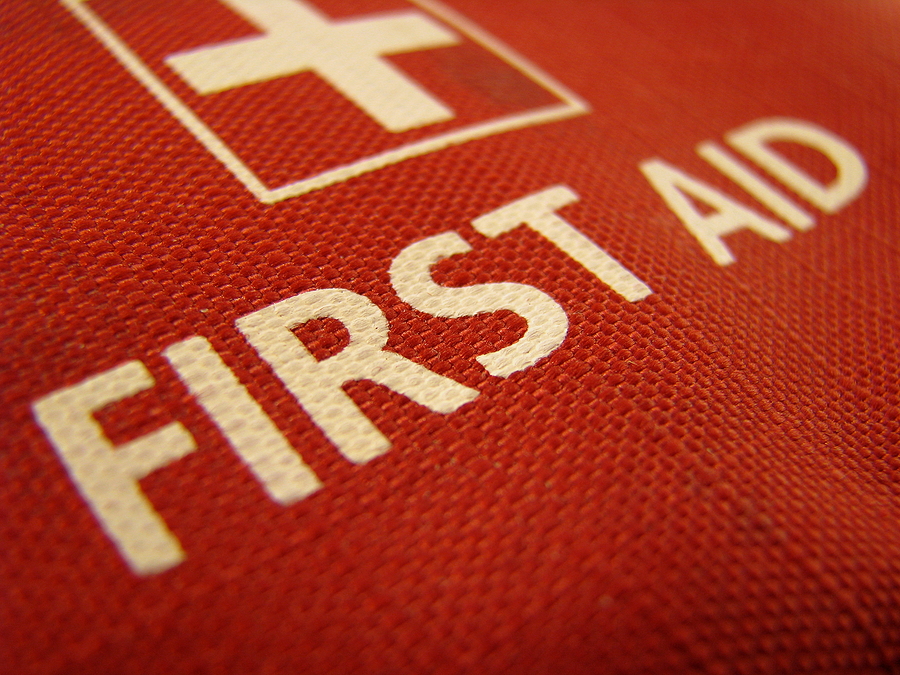 Close-up of a bright red first aid kit.