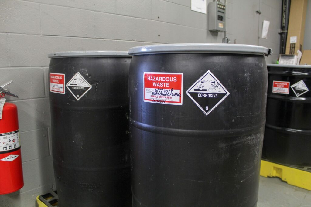 Barrels of household hazardous waste at an NEDT collection center.